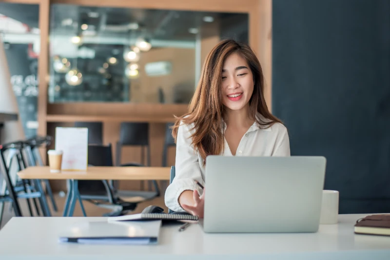 Charming asian businesswoman sitting working